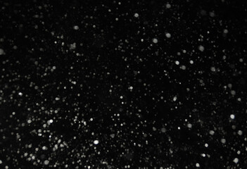 snow bokeh texture on black background