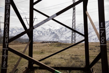 High voltage post with transmission towers