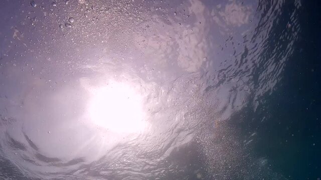 Under water film of beatyful air bubbles from scuba divers  rising to the water surface - Thailand - 4 k resolution