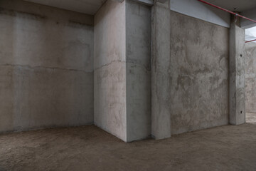 Concrete walls and pillars of the interior rough room - Powered by Adobe