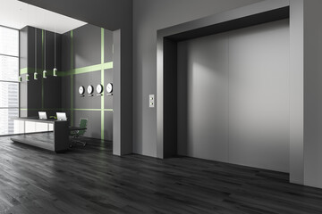 Black and green office entrance with elevator