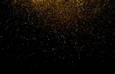 Fototapeta na wymiar Defocused Glittery Golden Lights over Dark Background