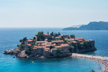 beautiful view of the beach and island Sveti-Stefan near Budva in Montenegro, Europe, Adriatic Sea and mountains