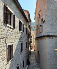 Ancient street, historical building in the old town of Kotor, Montenegro, Europe, Adriatic sea and mountains