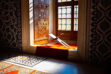 Islamic background photo. Rahle or lectern in the window of a mosque.