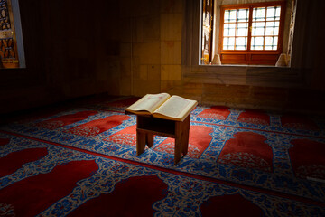 Islamic background photo. Holy Quran in the mosque.
