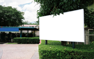 Fototapeta premium Mockup Large white blank billboard or white promotion poster displayed on the outdoor against. Promotion information for marketing announcements and details.