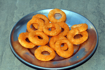 SOME EATABLE FOOT PUT IN A PAPEW BOWL