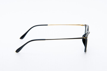 Fashion sunglasses gold and black frames on white background.