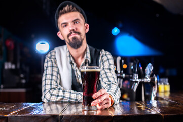 Confident bartending demonstrates his professional skills at the bar counter