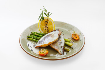 Seafood on a plate, food on a white background isolated - healthy food, asparagus, lemon. Nutrition for a healthy lifestyle