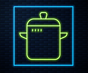 Glowing neon line Cooking pot icon isolated on brick wall background. Boil or stew food symbol. Vector