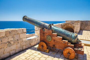 Fototapeta na wymiar Historic cannon of Fort Lovrijenac in the historic city center of Dubrovnik in Croatia, Europe.
