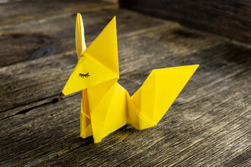 A fox origami with wooden background