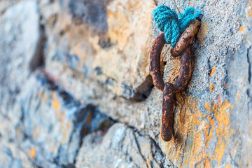 Selective focus shot of an old weathered rusty chains