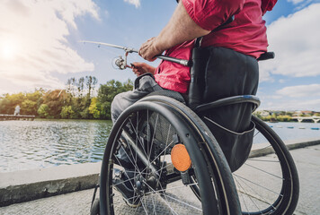 Person with a physical disability who uses wheelchair fishing from fishing pier.