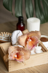 Spa composition with Thai orchid flowers and bath accessories.