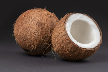Coconuts on a dark background. half coconut.