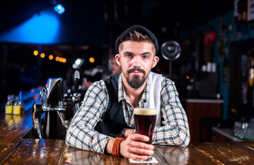 Barman creates a cocktail in the public house