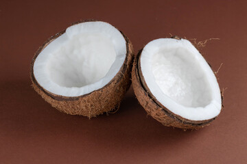 Coconut with half on brown background