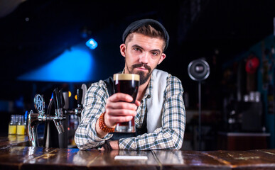 Bartender makes a cocktail at the saloon