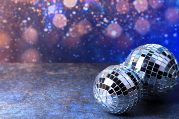 Disco balls with bright rays, night party background