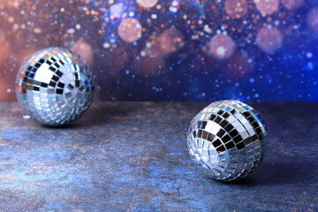 Disco balls with bright rays, night party background