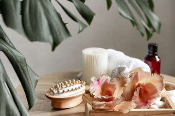 Spa composition with Thai orchid flowers and bath accessories.