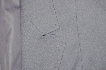 fabric texture from part of gray coat with collar and lining