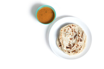 Parotta with chicken curry isolated on a white background. is a delicacy from the state of Kerala