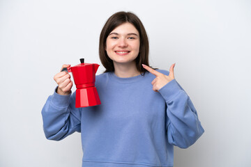 Young Russian woman holding coffee pot isolated on white background giving a thumbs up gesture