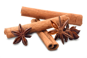 Spicy cinnamon sticks and anise stars  isolated on white