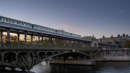 Fototapeta na wymiar Metro passing by on the bridge in Paris