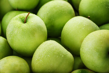 Ripe and juicy Green apples with dew drops.