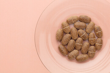 Homeopathic pill supplement. Alternative Medicine. Vitamin capsules.