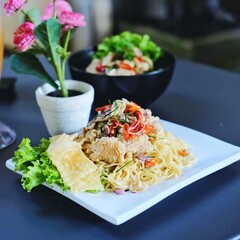 Dori confusion noodles with matah sauce and dory fish topping served crispy. savory and different combination.