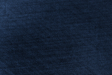 Dark blue denim jeans fabric with grunge texture for background