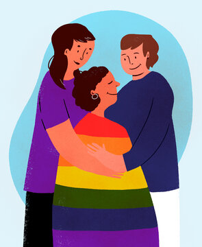 Couple holding child with LGBTQIA+ flag
