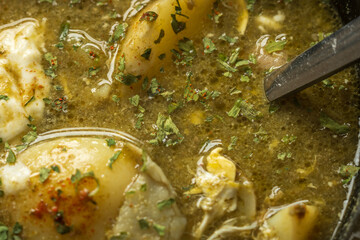 green sorrel soup in dip plate closeup