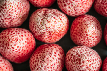 frozen ripe strawberries background closeup