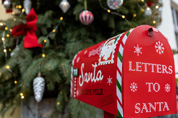 Santa Claus mailbox and gift with bow and ribbons. Gift for Christmas.