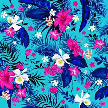 Seamless tropical motif with leaves and flowers