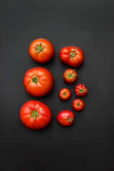 Tomatoes on a black background