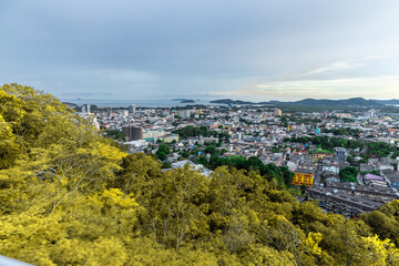 Obraz premium Panoramic view old phuket town viewed from Khaorang Hill and in the distance is Challong Bay and the islands big Buddha and Rawai Phuket Thailand