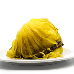 OLYMPUS DIGITAL CAMERAPickled cabbage head on white plate. Traditional asian style preserving food with sour and salty taste. Spot focus