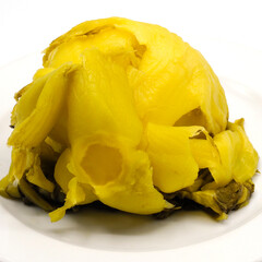 Pickled cabbage head on white plate. Traditional asian style preserving food with sour and salty taste. Spot focus