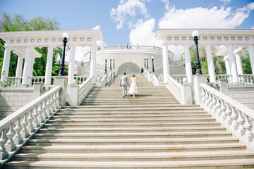 Fototapeta premium young couple in love holding hands and looking into the distance