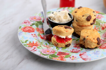 English Tea Fresh Homemade Scones with Clotted Cream and Jam, Copy Space, Selected Focus