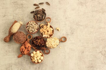 Various Nuts, Seed, Raisin on Wooden Bowl, Concept Diet Healthy Food. Copy Space for Text, Top View
