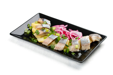 Appetizer with lightly salted herring, boiled potatoes and onions. Isolated on a white background